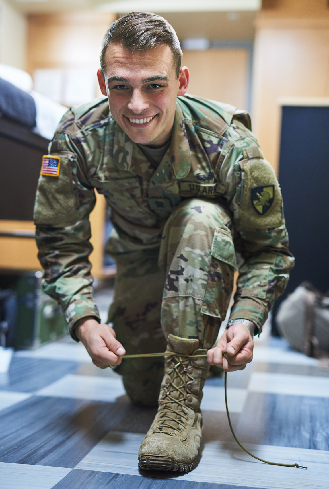 shot-of-a-young-soldier-tying-his-boot-shoelaces-i-2023-11-27-05-20-39-utc